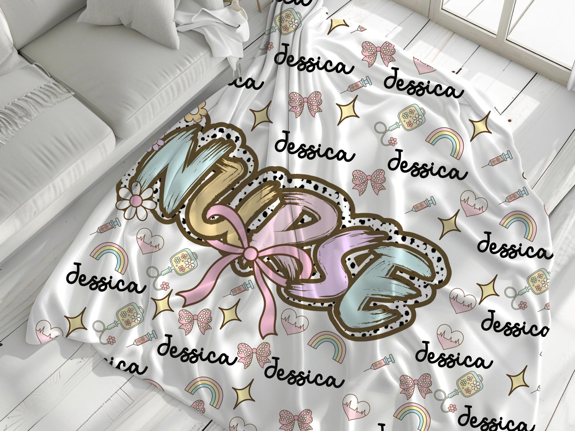Personalized nurse name blanket  with the word nurse in a pastel dalmation dot  print and pink bow, with name and nurse accessories surrounding perfect gift for nurses