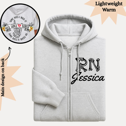 Women’s full zip hoodie with personalized name for nurse's perfect gift for nurses, has a phrase on the back some days i rock it and some days it rocks me.
