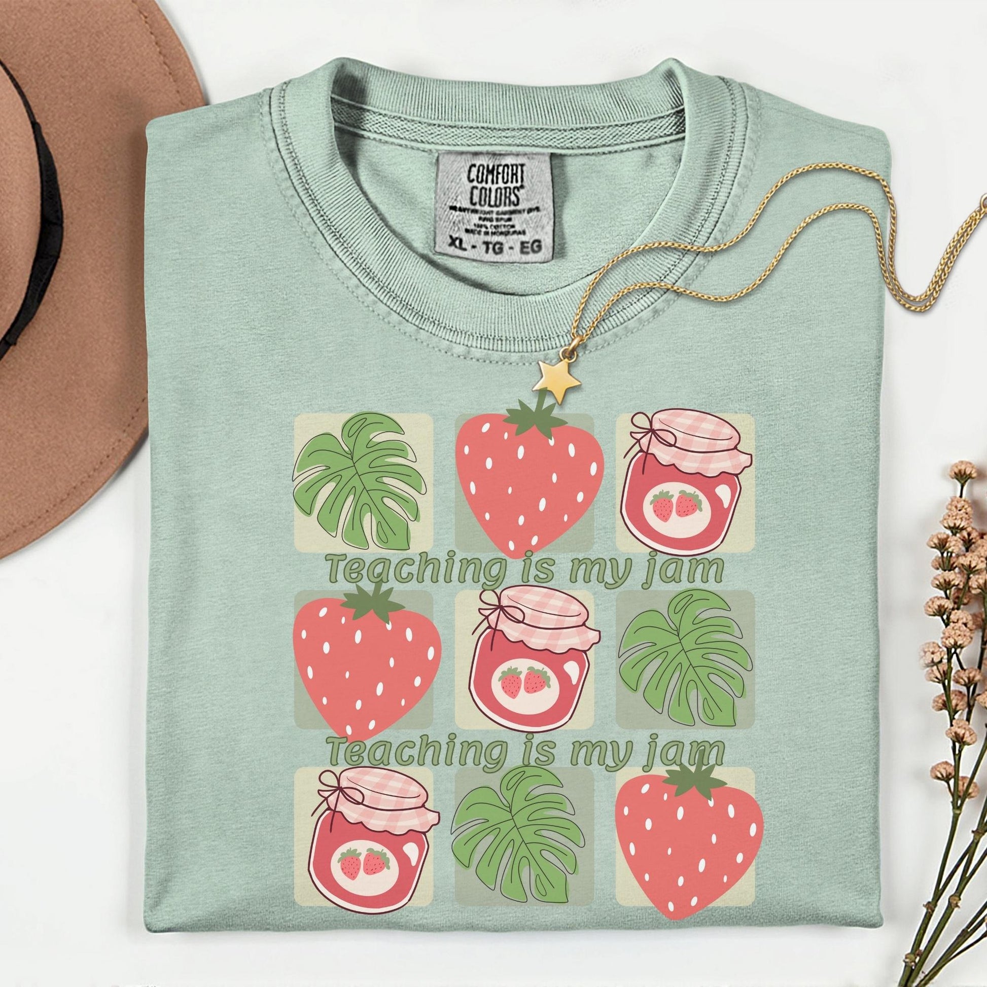 Women’s green t-shirt for teachers with the phrase teaching is my jam, strawberry and green leaves perfect teacher gift.
