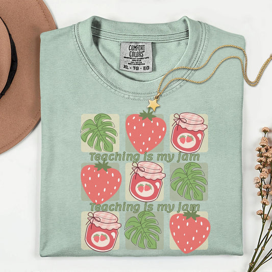 Women’s green t-shirt for teachers with the phrase teaching is my jam, strawberry and green leaves perfect teacher gift.