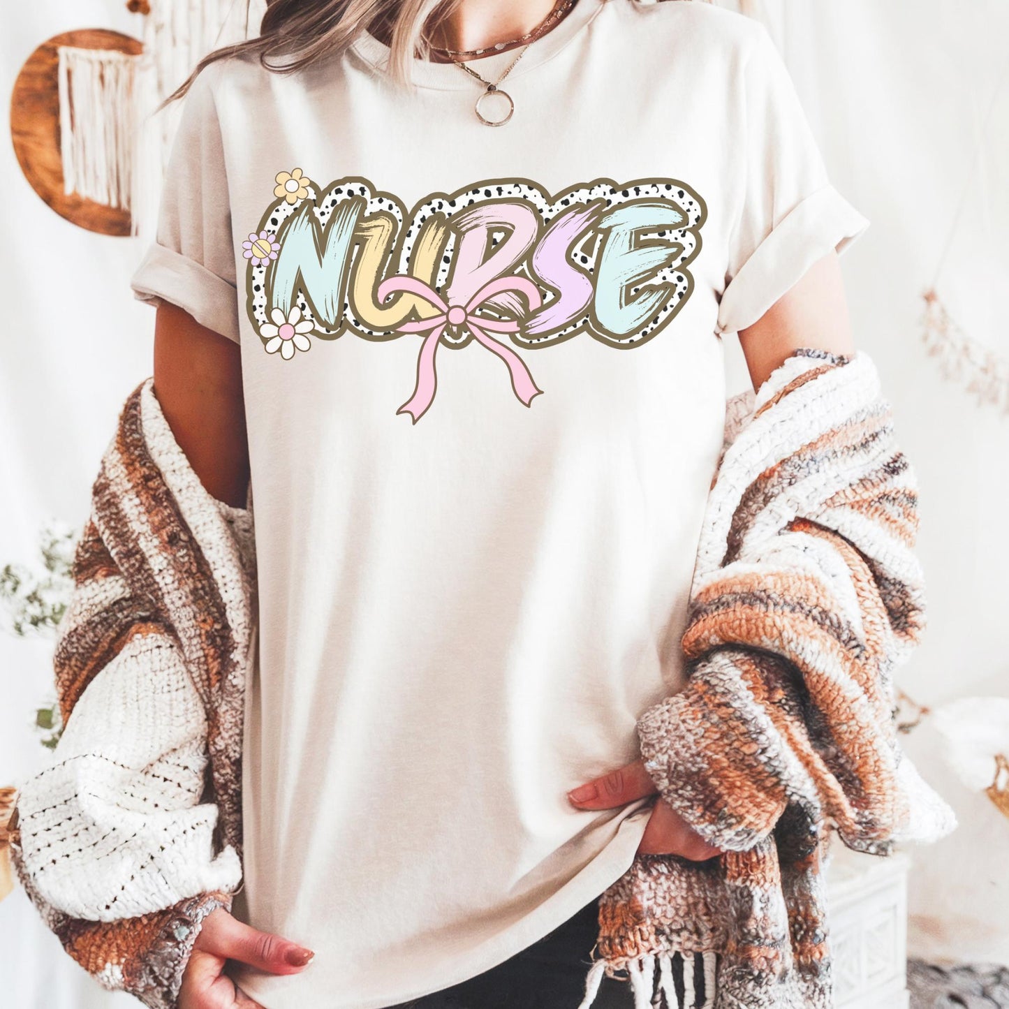 Women’s ivory nurse t-shirt with the word nurse in a pastel dalmation dot  print, gift for nurses