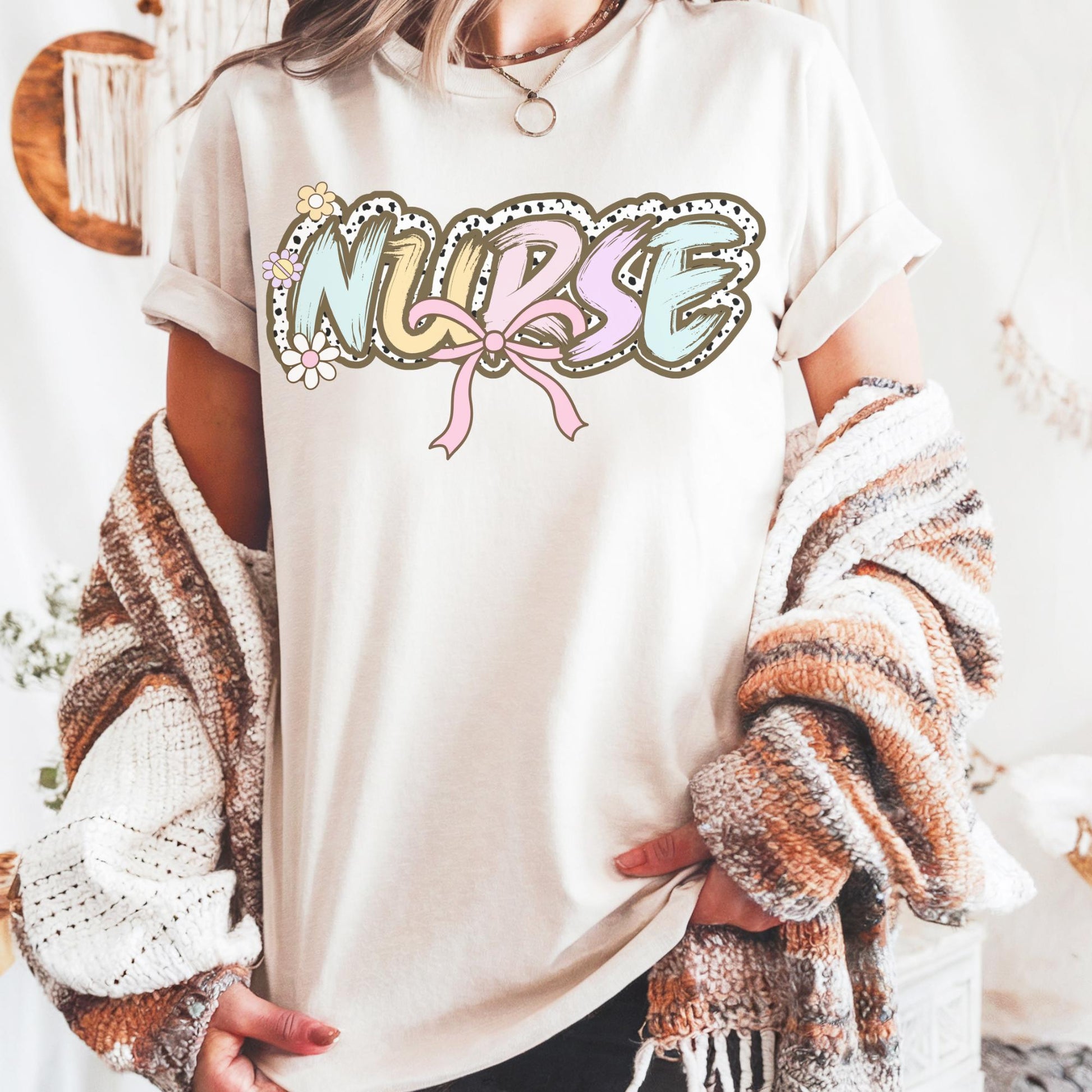 Women’s ivory nurse t-shirt with the word nurse in a pastel dalmation dot  print, gift for nurses