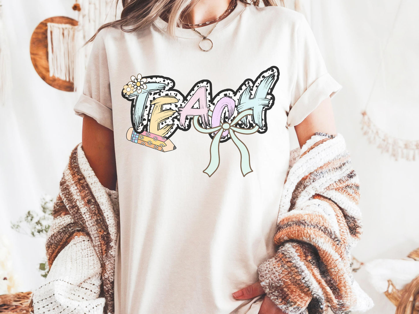 Women’s ivory teach t-shirt with the word teach in a pastel dalmation dot  print, gift for teachers