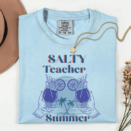 Women’s blue t-shirt for teacher's summer vacation with the phrase salty teacher summer,  perfect for summer teacher trips.