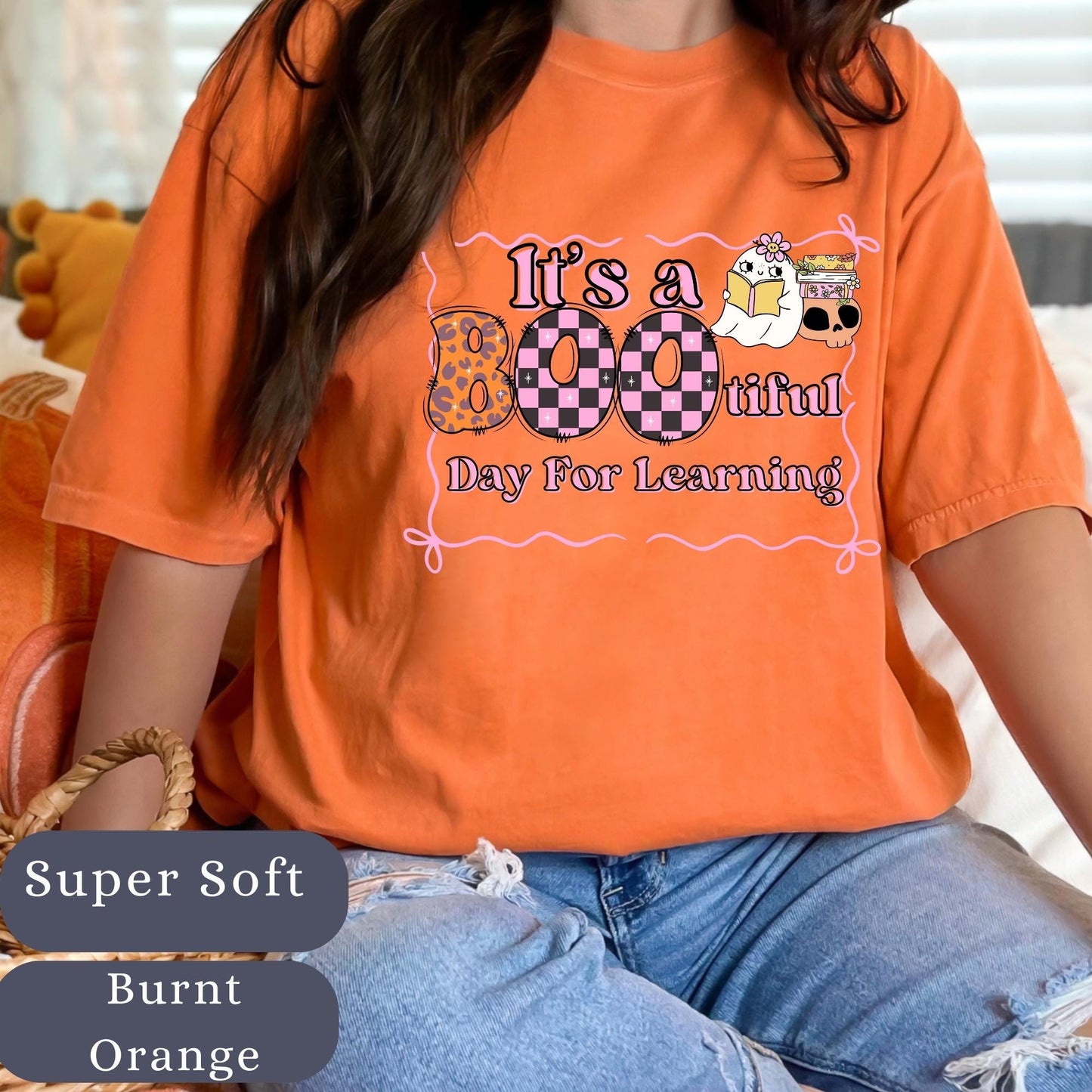 Women’s burnt orange t-shirt with the phrase tit's a bootiful day for learning  has teacher accessories  spooky halloween teacher themed.