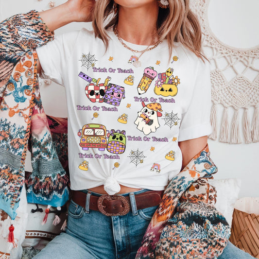 Women’s  white t-shirt  for teacher's halloween spooky themed with the phrase trick or teach  perfect gift for teachers.