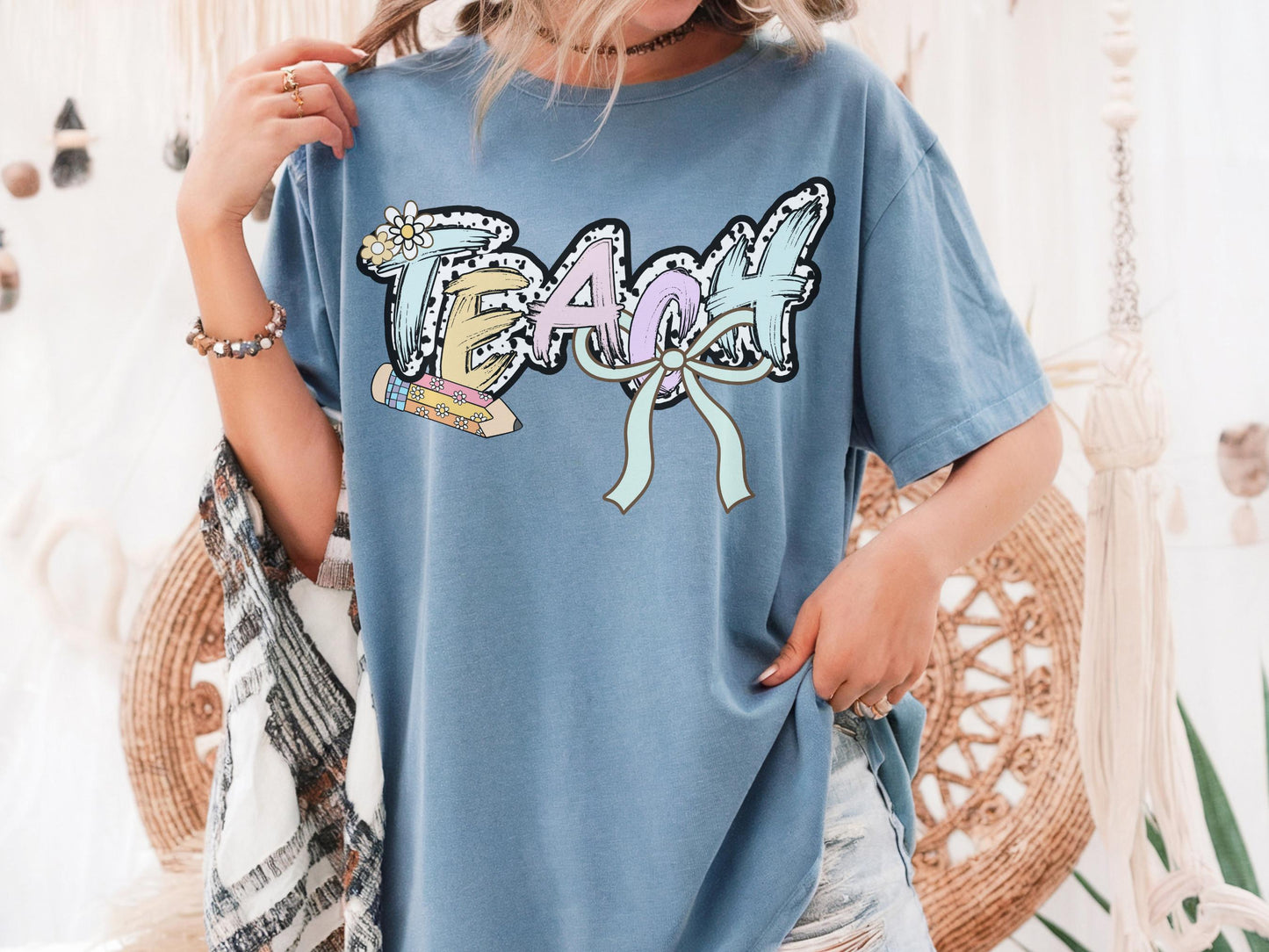Women’s blue teach t-shirt with the word teach in a pastel dalmation dot  print, gift for teachers