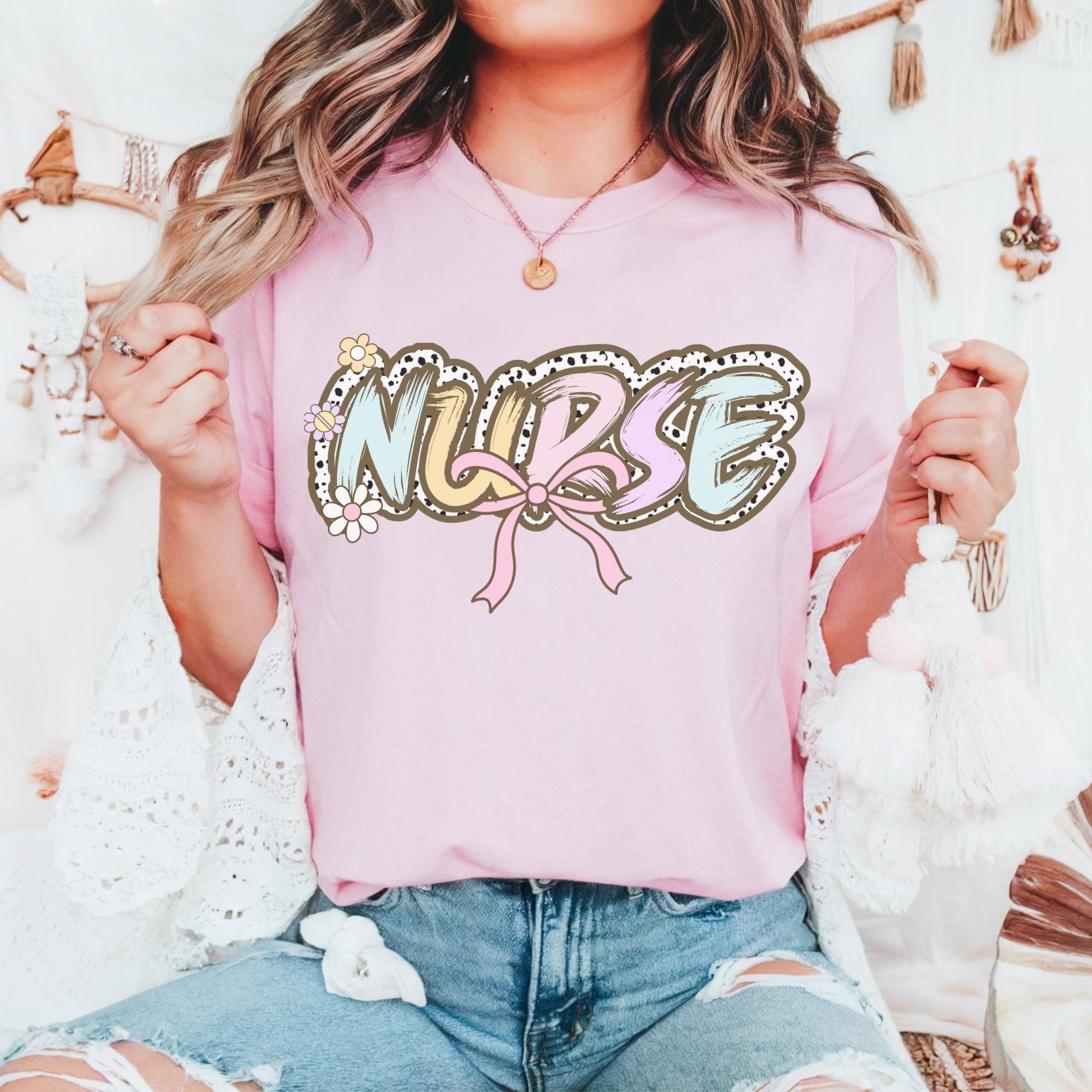 Women’s pink nurse t-shirt with the word nurse in a pastel dalmation dot  print, gift for nurses