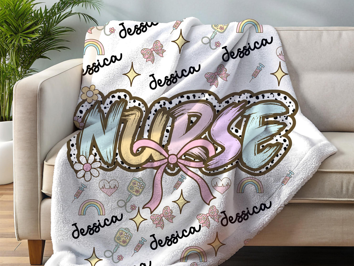 Personalized nurse name blanket  with the word nurse in a pastel dalmation dot  print and pink bow, with name and nurse accessories surrounding perfect gift for nurses