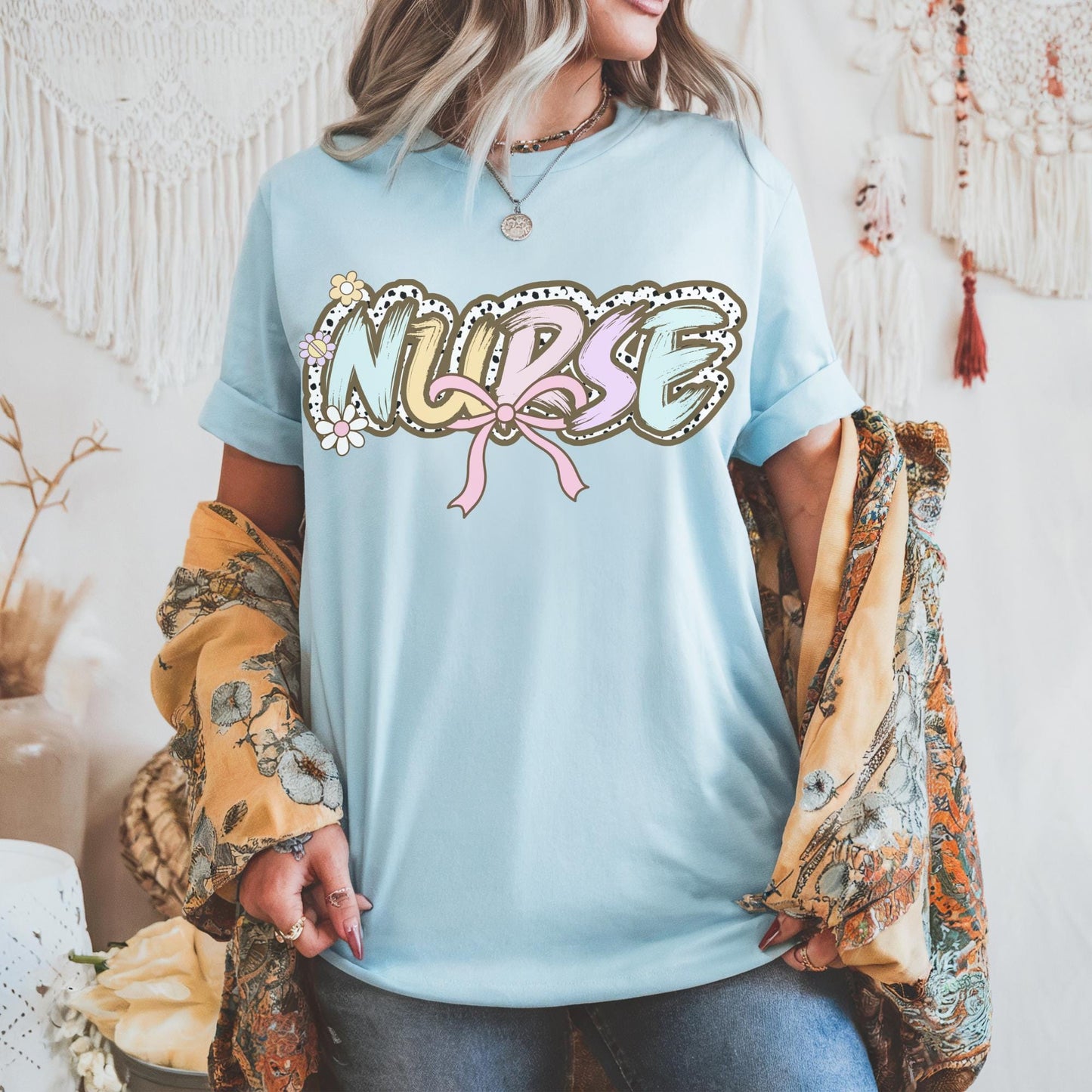 Women’s light blue nurse t-shirt with the word nurse in a pastel dalmation dot  print, gift for nurses