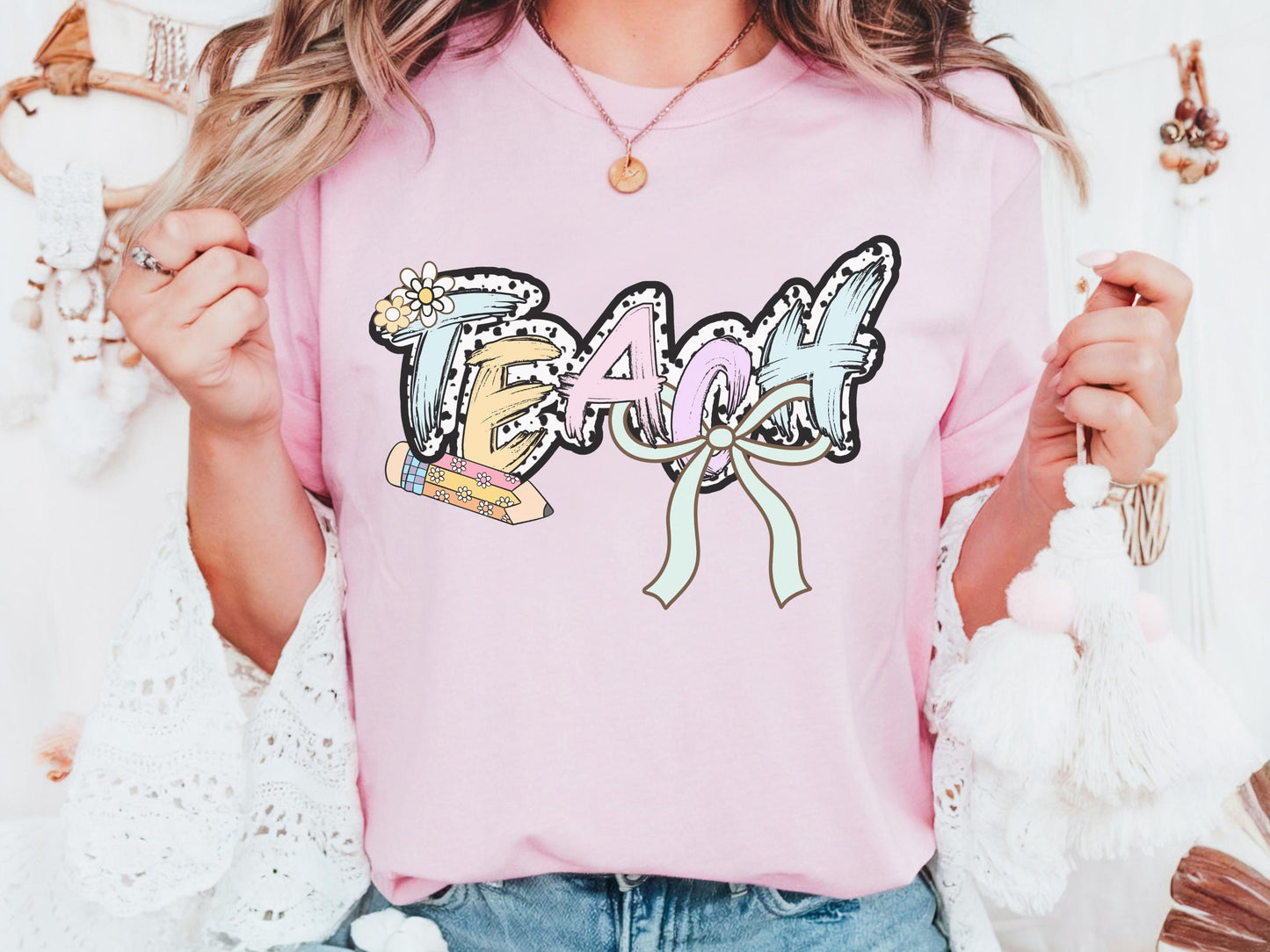 Women’s pink teach t-shirt with the word teach in a pastel dalmation dot  print, gift for teachers